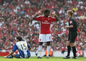 Arsenal V Wigan Athletic 2009-10 Prints: Alex Song (Arsenal) Jordi Gomez (Wigan) and Referee Mike Jones
