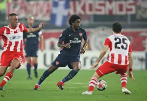 Olympiacos V Arsenal 2009-10 Prints: Alex Song (Arsenal) Kostas Mitroglou and Enzo Maresca (Olympiacos). Olympiacos 1