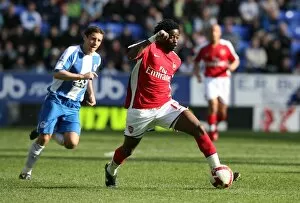 Images Dated 11th April 2009: Alex Song (Arsenal) Michael Brown (Wigan)