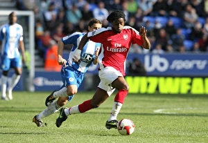 Images Dated 11th April 2009: Alex Song (Arsenal) Michael Brown (Wigan)