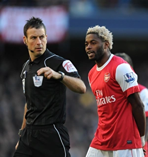Manchester City v Arsenal 2010-11 Collection: Alex Song (Arsenal) and referee Mark Clattenburg. Manchester City 0: 3 Arsenal