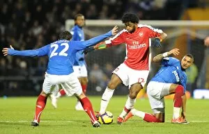 Portsmouth v Arsenal 2009-10 Collection: Alex Song (Arsenal) Richard Hughes and Kevin Prince Boateng (Portsmouth)