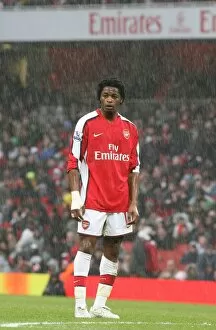Images Dated 8th March 2009: Alex Song (Arsenal) stands in the rain