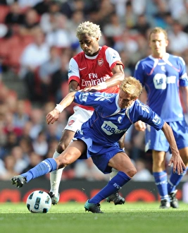 Arsenal v Bolton Wanderers 2010-11 Collection: Alex Song (Arsenal) Stuart Holden (Bolton). Arsenal 4: 1 Blackburn Rovers