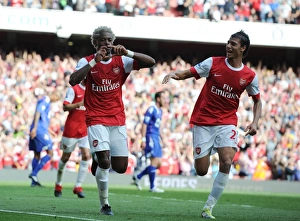 Arsenal v Bolton Wanderers 2010-11 Collection: Alex Song celebrates scoring the 3rd Arsenal goal with Marouane Chamakh