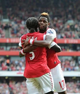 Arsenal v Bolton Wanderers 2011-12 Collection: Alex Song celebrates scoring Arsenals 3rd goal with Bacary Sagna. Arsenal 3: 0 Bolton Wanderers