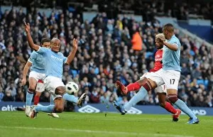 Manchester City v Arsenal 2010-11 Collection: Alex Song shoots past Man City goalkeeper Joe Hart to score the 2nd Arsenal goal