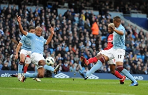 Manchester City v Arsenal 2010-11 Collection: Alex Song shoots past Man City goalkeeper Joe Hart to score the 2nd Arsenal goal