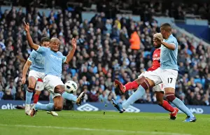Alex Song shoots past Man City goalkeeper Joe Hart to score the 2nd Arsenal goal