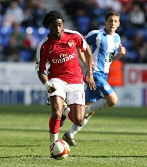 Wigan Athletic v Arsenal 2008-09 Collection: Alex Song's Dominance: Arsenal's 4-1 Victory Over Wigan Athletic in the Premier League