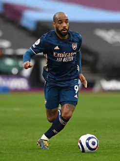 Alexandre Lacazette in Action: Arsenal vs. West Ham United - Premier League Showdown