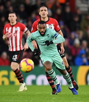 Images Dated 16th December 2018: Alexandre Lacazette (Arsenal) Oriol Romeu (Southampton). Southampton 3: 2 Arsenal