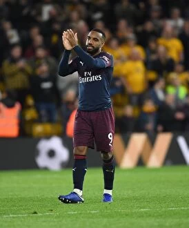 Images Dated 24th April 2019: Alexandre Lacazette Celebrates with Arsenal Fans after Wolverhampton Wanderers Victory