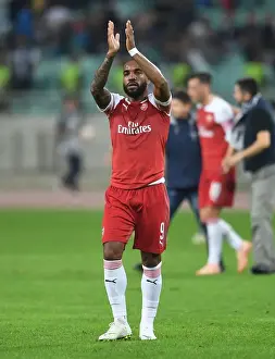 Alexandre Lacazette Celebrates with Arsenal Fans after UEFA Europa League Victory over Qarabag FK