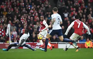 Arsenal V Tottenham Hotspur 2017-18 Prints: Alexandre Lacazette crosses the ball to Alexis Sanchez to score Arsenals 2nd goal