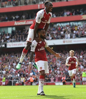 Arsenal v West Ham United 2017-18 Collection: Alexandre Lacazette and Danny Welbeck Celebrate Goals: Arsenal's Triumph Over West Ham United