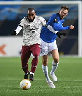 Images Dated 26th November 2020: Alexandre Lacazette Faces Off Against Molde FK in Europa League Clash