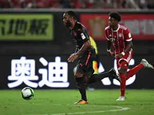 Bayern Munich V Arsenal 2017-18 Prints: Alexandre Lacazette vs. David Alaba: Battle at the Shanghai Pre-Season Friendly between Bayern Munich and Arsenal