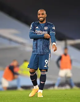 Alexis Lacazette Faces Manchester City at Empty Etihad Stadium during the 2020-21 Premier League Match