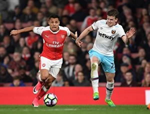 Images Dated 5th April 2017: Alexis Sanchez: Agile Star Outmaneuvers Sam Byram during Arsenal's Victory over West Ham