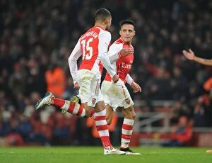 Images Dated 4th January 2015: Alexis Sanchez and Alex Oxlade-Chamberlain Celebrate Goals in Arsenal's FA Cup Victory over Hull