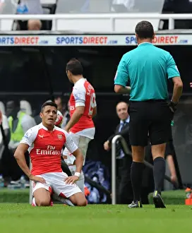Newcastle United V Arsenal 2015-16 Prints: Alexis Sanchez Argues with Referee Marriner over Foul Call during Newcastle vs
