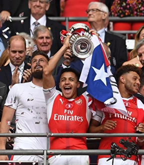 Alexis Sanchez (Arsenal) lifts the FA Cup