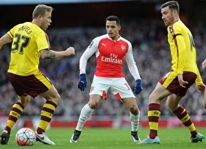 Images Dated 30th January 2016: Alexis Sanchez (Arsenal) nutmeg assist on Scott Arfield (Burnley). Arsenal 2: 1 Burnley
