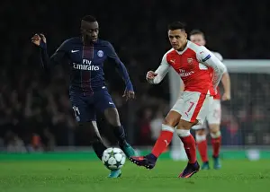 Arsenal V Paris Saint-Germain 2016-17 Prints: Alexis Sanchez Evades Matuidi: Thrilling Arsenal vs. PSG Champions League Clash