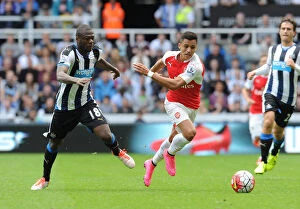 Newcastle United v Arsenal 2015-16 Collection: Alexis Sanchez Fouled by Chancel Mbemba in Intense 2015-16 Premier League Clash