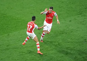 Arsenal V Galatasaray 2014/15 Champions League Prints: Alexis Sanchez and Mesut Ozil's Triumphant Moment: Arsenal's Third Goal vs
