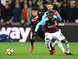 West Ham United v Arsenal 2017-18 Collection: Alexis Sanchez Outmaneuvers Pedro Obiang: A Premier League Showdown