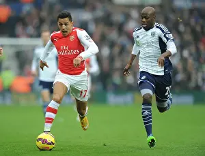 West Bromwich Albion V Arsenal 2014/15 Prints: Alexis Sanchez Outmaneuvers Youssouf Mulumbu in Arsenal's Premier League Clash against West Bromwich Albion