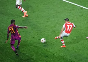 Arsenal V Galatasaray 2014/15 Champions League Prints: Alexis Sanchez Scores Third Goal Against Aurelien Chedjou in Arsenal's UEFA Champions League Victory