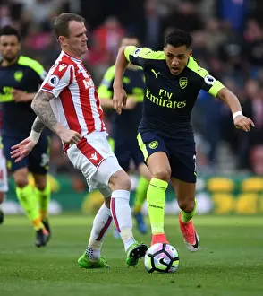 Stoke City V Arsenal 2016-17 Prints: Alexis Sanchez vs. Glenn Whelan: Intense Battle at Stoke City vs
