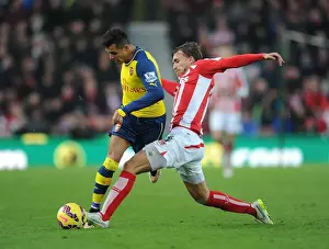 Stoke City V Arsenal 2014-15 Prints: Alexis Sanchez's Sneaky Move: Outsmarting Marc Muniesa in the Stoke City vs