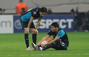 Olympiacos V Arsenal 2011-12 Prints: Andre Santos Holds Injured Ankle as Yossi Benayoun Looks On: Olympiacos vs
