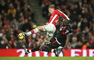 Arsenal V Stoke City 2009-10 Prints: Andrey Arshavin (Arsenal) Abdoulaye Faye (Stoke). Arsenal 2: 0 Stoke City