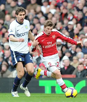 Arsenal V Aston Villa 2009-10 Prints: Andrey Arshavin (Arsenal) Carlos Cuellar (Aston Villa). Arsenal 3: 0 Aston Villa