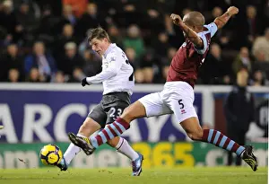 Burnley V Arsenal 2009-10 Prints: Andrey Arshavin (Arsenal) Clarke Carlisle (Burnley). Burnley 1: 1 Arsenal