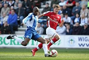 Images Dated 11th April 2009: Andrey Arshavin (Arsenal) Emerson Boyce (Wigan)