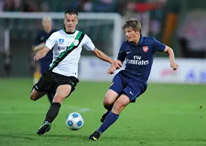 Andrey Arshavin (Arsenal) Fereng Racz (Szombathelyi)