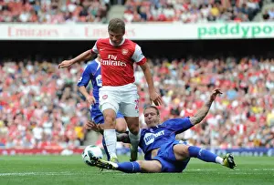 Arsenal V Bolton Wanderers 2010-11 Prints: Andrey Arshavin (Arsenal) Gretar Steinsson (Bolton). Arsenal 4: 1 Blackburn Rovers