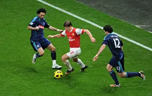 Arsenal V Stoke City 2010-2011 Prints: Andrey Arshavin (Arsenal) Jermaine Pennant and Marc Wilson (Stoke). Arsenal 1