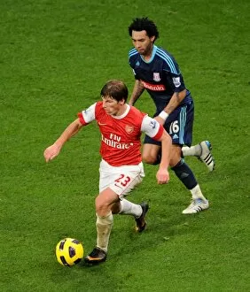 Arsenal v Stoke City 2010-2011 Collection: Andrey Arshavin (Arsenal) Jermaine Pennant (Stoke). Arsenal 1: 0 Stoke City