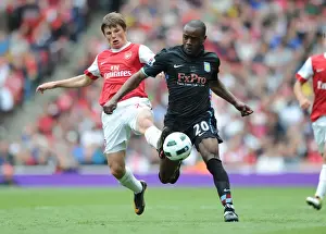 Arsenal V Aston Villa 2010-11 Prints: Andrey Arshavin (Arsenal) Nigel Reo-Coker (Aston Villa). Arsenal 1: 2 Aston Villa