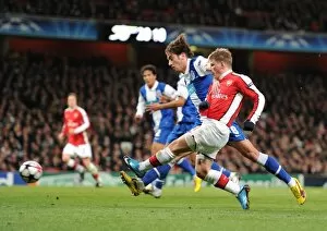 Andrey Arshavin (Arsenal) Nuno Coelho (Porto). Arsenal 5: 0 FC Porto, UEFA Champions League First Knockout Round