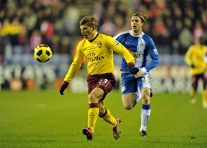 Andrey Arshavin (Arsenal) Ronnie Stam (Wigan). Wigan Athletic 2:2 Arsenal Andrey Arshavin (Arsenal) Ronnie Stam (Wigan). Wigan Athletic 2:2 Arsenal