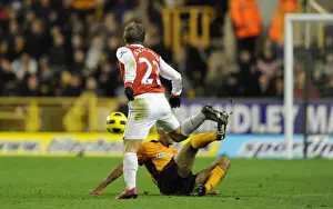 Andrey Arshavin (Arsenal) tackled by Karl Henry (Wolves). Wolverhampton Wanderers 0