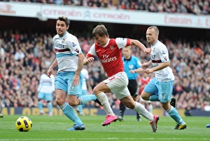 Arsenal V West Ham United 2010-11 Prints: Andrey Arshavin (Arsenal) Valon Behrami (West Ham). Arsenal 1: 0 West Ham United